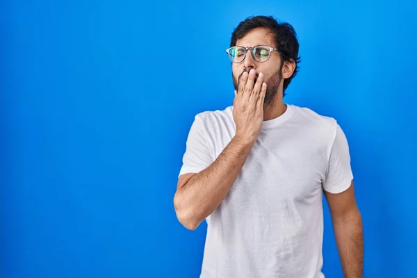 Handsome Latin Man Standing Blue Background Bored Yawning Tired Covering — Fotografia de Stock