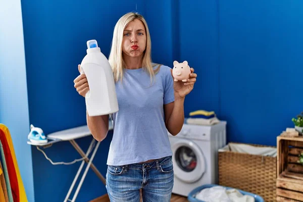 Beautiful Woman Doing Laundry Holding Detergent Bottle Piggy Bank Puffing — Stock Photo, Image