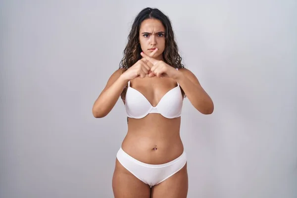 Jovem Hispânico Mulher Vestindo Branco Lingerie Rejeição Expressão Cruzando Dedos — Fotografia de Stock