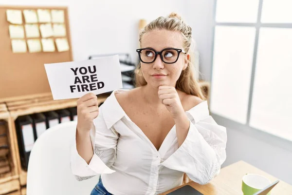 Young Caucasian Woman Holding You Fired Banner Office Serious Face — Stock Photo, Image