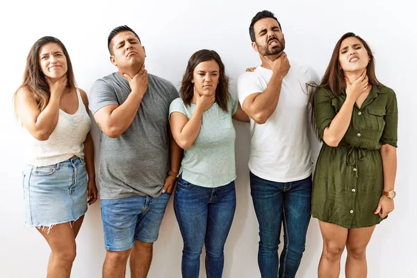 Group Young Hispanic Friends Standing Together Isolated Background Touching Painful — ストック写真