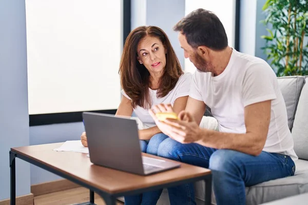 Middle Age Man Woman Couple Accounting Using Smartphone Laptop Home — Fotografia de Stock