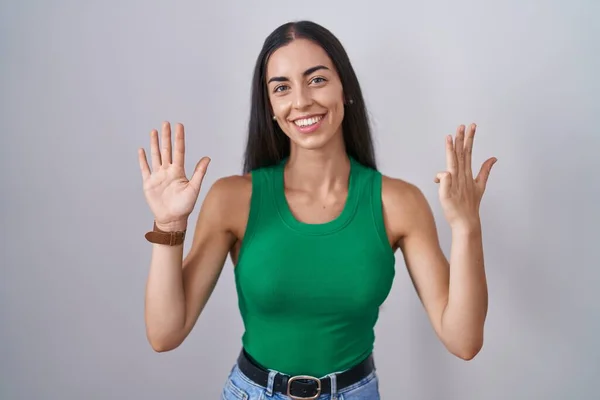 Young Woman Standing Isolated Background Showing Pointing Fingers Number Nine — Φωτογραφία Αρχείου