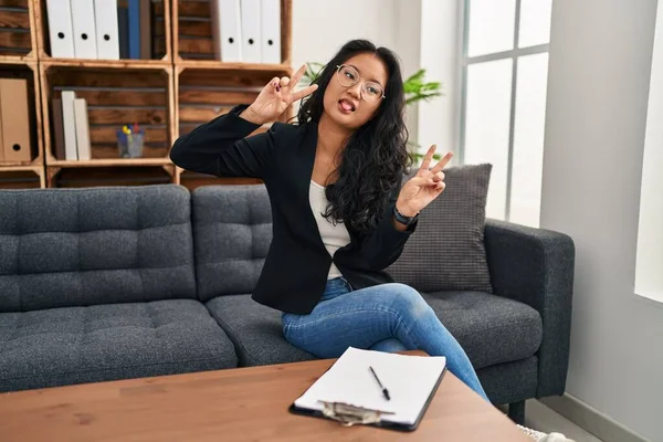Young Asian Woman Consultation Office Smiling Tongue Out Showing Fingers — Fotografia de Stock