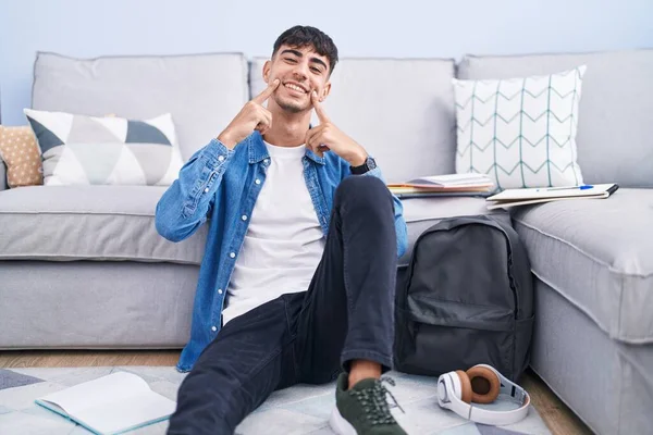 Young Hispanic Man Sitting Floor Studying University Smiling Open Mouth — Zdjęcie stockowe