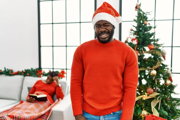 Young African American Man Standing Christmas Tree Winking Looking Camera — Stock Photo, Image