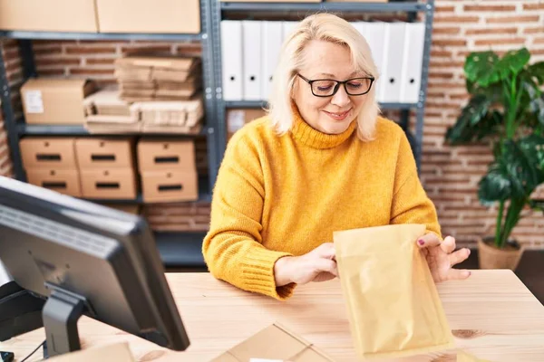 Middle Age Blonde Woman Ecommerce Business Worker Unboxing Package Office — Stock Photo, Image