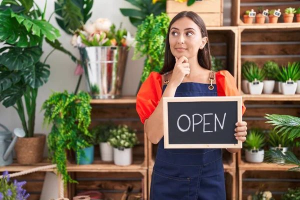 Young Hispanic Woman Working Florist Holding Open Sign Serious Face — Stockfoto