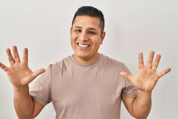 Hispanic Young Man Standing White Background Showing Pointing Fingers Number — Stock Photo, Image