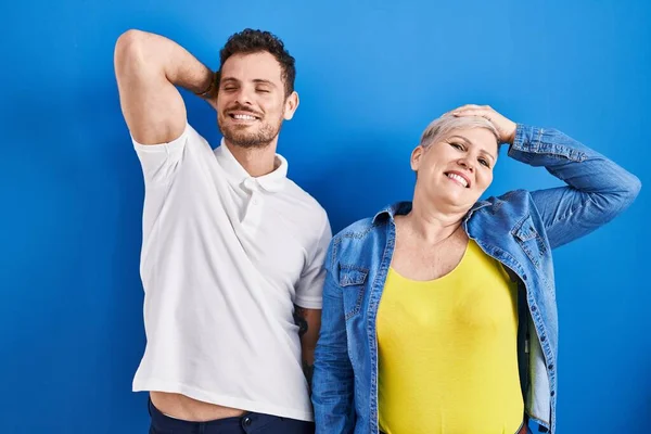 Young Brazilian Mother Son Standing Blue Background Smiling Confident Touching — kuvapankkivalokuva