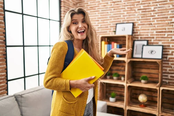 Young Woman Wearing Student Backpack Holding Books Celebrating Achievement Happy — Stock Photo, Image