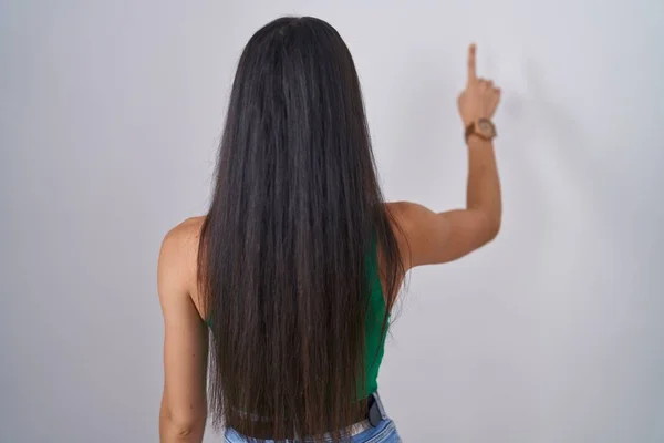 Young Woman Standing Isolated Background Posing Backwards Pointing Ahead Finger — Stock fotografie