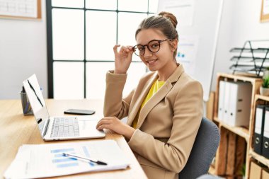 Adorable girl business worker using laptop working at office
