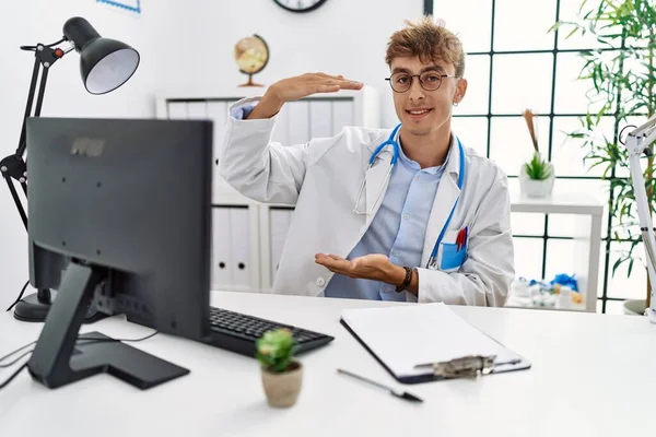 Young Caucasian Doctor Man Working Clinic Gesturing Hands Showing Big — Stok fotoğraf