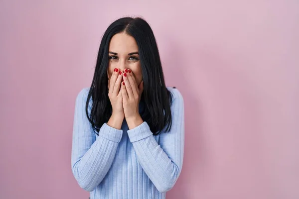 Hispanic Woman Standing Pink Background Laughing Embarrassed Giggle Covering Mouth — Zdjęcie stockowe