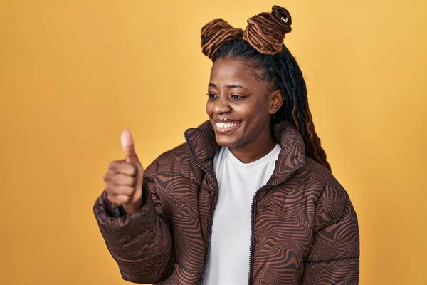African Woman Braided Hair Standing Yellow Background Looking Proud Smiling — Fotografia de Stock