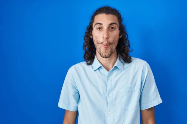 Young Hispanic Man Standing Blue Background Making Fish Face Lips — Stok fotoğraf