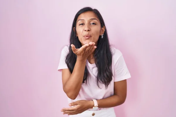 Young Hispanic Woman Standing Pink Background Looking Camera Blowing Kiss — Stok fotoğraf