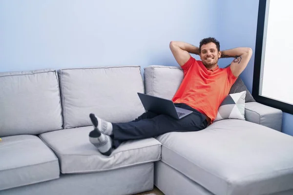Young Hispanic Man Using Laptop Sitting Sofa Home — Stockfoto