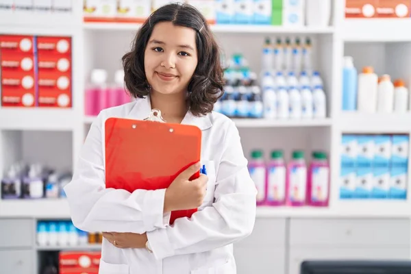 Young Woman Pharmacist Hugging Clipboard Pharmacy — Stockfoto
