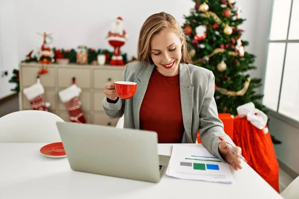 Young Caucasian Woman Drinking Coffee Working Sitting Christmas Tree Home —  Fotos de Stock