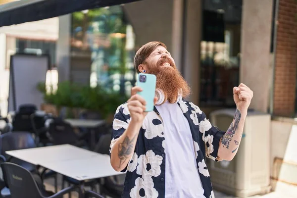 Young Redhead Man Using Smartphone Winner Expression Street — Fotografia de Stock