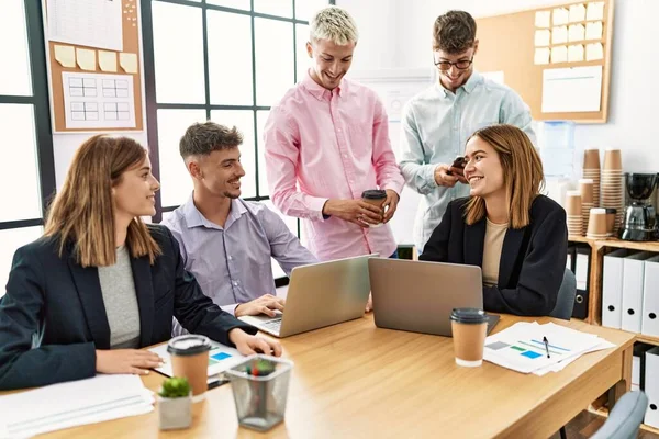 Group of business workers smiling happy working at the office.