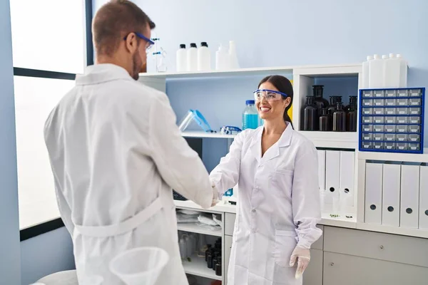 Man Woman Scientist Partners Smiling Confident Shake Hands Laboratory — Stockfoto