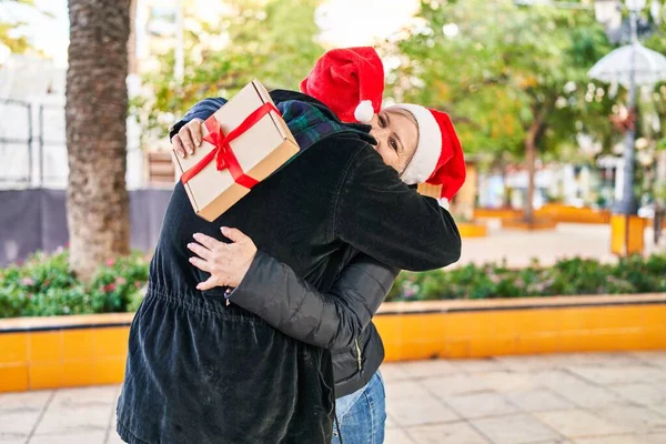 Mother Son Hugging Each Other Holding Christmas Gift Park — Stockfoto