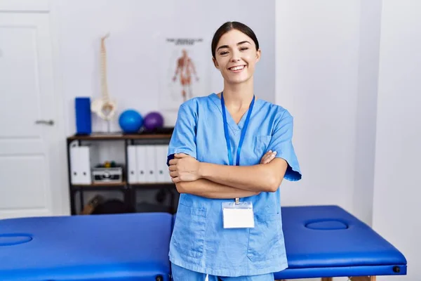 Young Hispanic Woman Wearing Physiotherapist Uniform Standing Clinic Happy Face — Fotografia de Stock