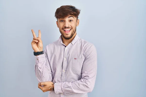 Arab Man Beard Standing Blue Background Smiling Happy Face Winking — Stockfoto