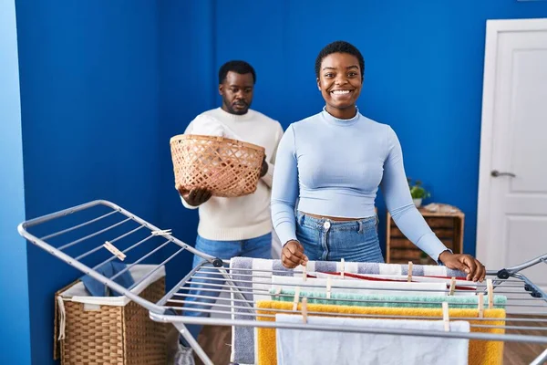 Young African American Couple Hanging Clothes Clothesline Looking Positive Happy — Stock Photo, Image