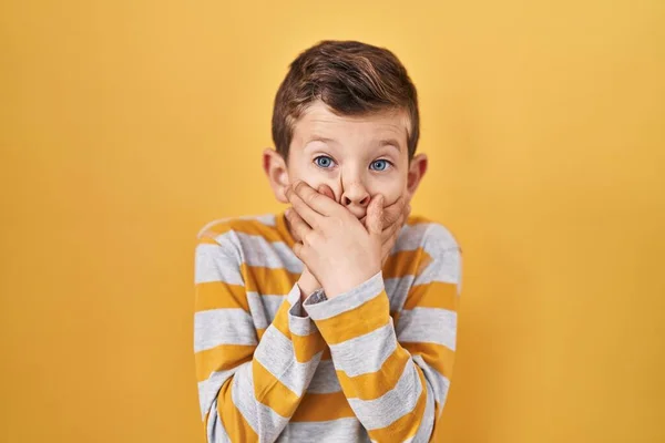 Young Caucasian Kid Standing Yellow Background Shocked Covering Mouth Hands — Stock Photo, Image