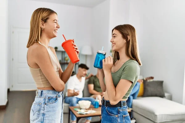 Two Young Women Party Smiling Happy Drinking Soda Home — ストック写真