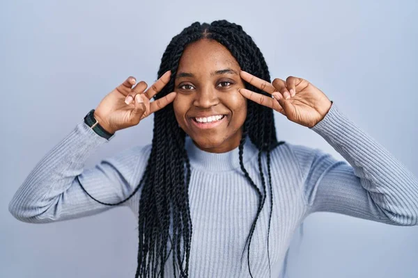 African American Woman Standing Blue Background Doing Peace Symbol Fingers — Stockfoto
