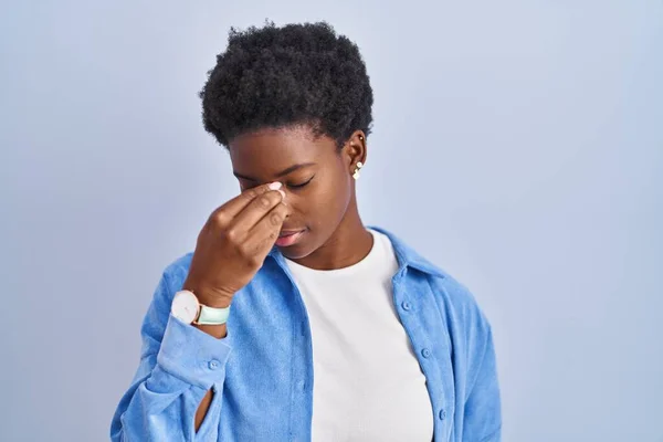 African American Woman Standing Blue Background Tired Rubbing Nose Eyes — Fotografia de Stock