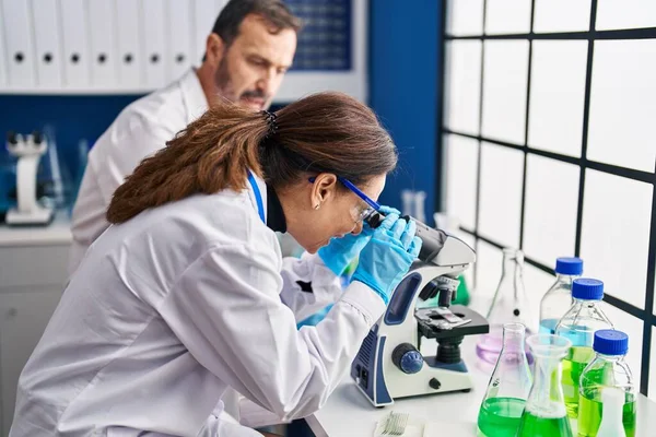 Middle Age Man Woman Scientists Using Microscope Working Laboratory — Fotografia de Stock