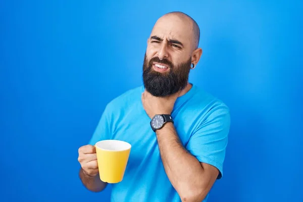 Young Hispanic Man Beard Tattoos Drinking Cup Coffee Touching Painful — Zdjęcie stockowe