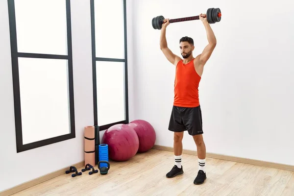 Young Arab Man Training Dumbbells Sport Center — Stockfoto