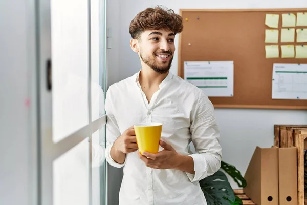 Young Arab Man Drinking Coffee Leaning Window Office — Foto de Stock