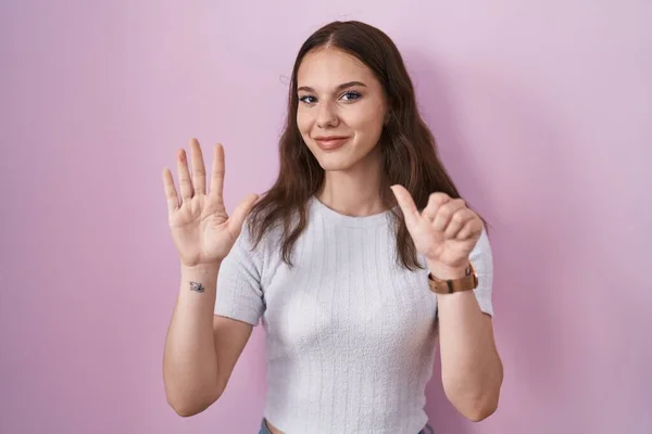 Young Hispanic Girl Standing Pink Background Showing Pointing Fingers Number — Fotografia de Stock