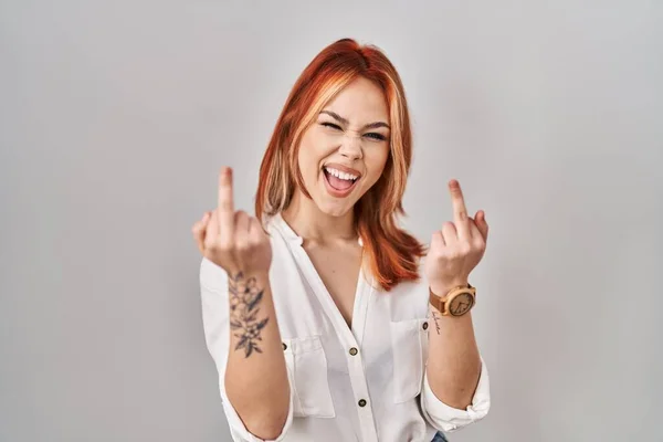 Young Caucasian Woman Standing Isolated Background Showing Middle Finger Doing — Stock fotografie