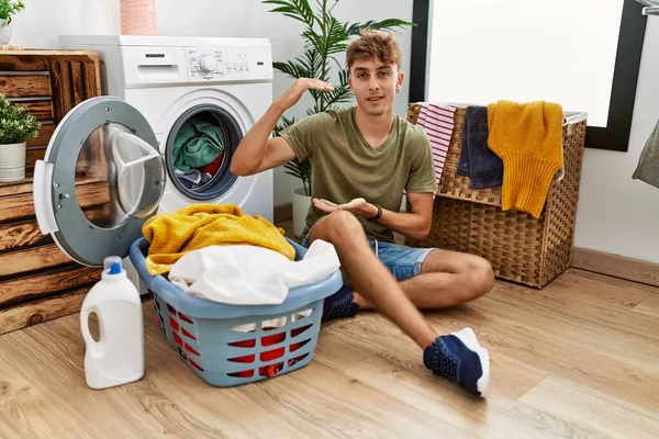 Young Caucasian Man Putting Dirty Laundry Washing Machine Gesturing Hands — Stock Photo, Image