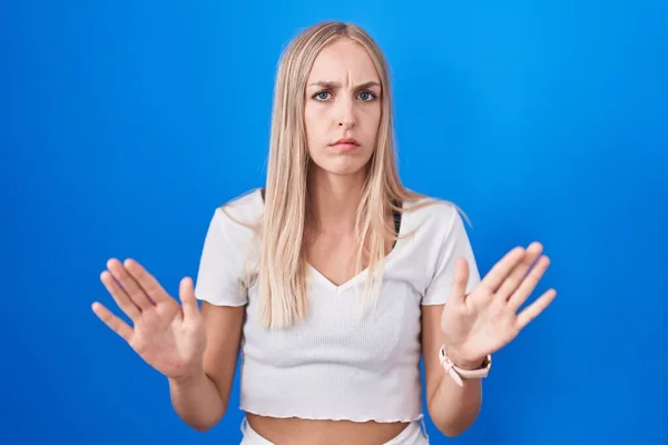 Young Caucasian Woman Standing Blue Background Moving Away Hands Palms — Stock Photo, Image