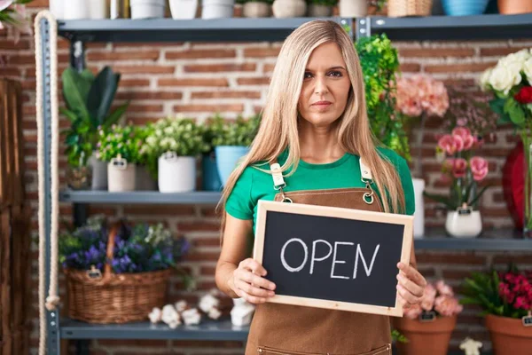 Young Woman Working Florist Holding Open Sign Relaxed Serious Expression — Stok fotoğraf