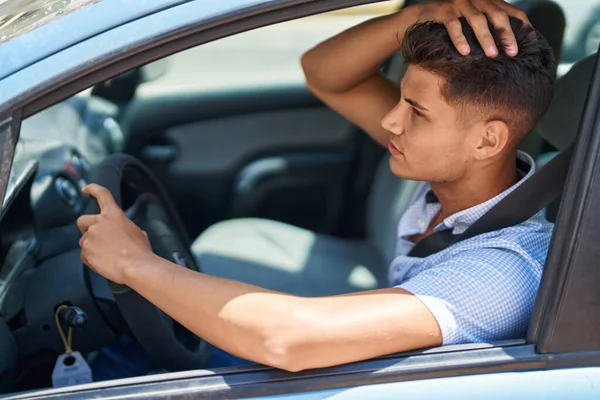 Young Hispanic Man Unhappy Driving Car Street — Stockfoto