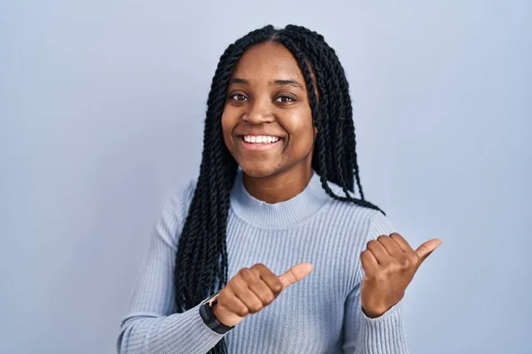 African American Woman Standing Blue Background Pointing Back Hand Thumbs — Foto Stock