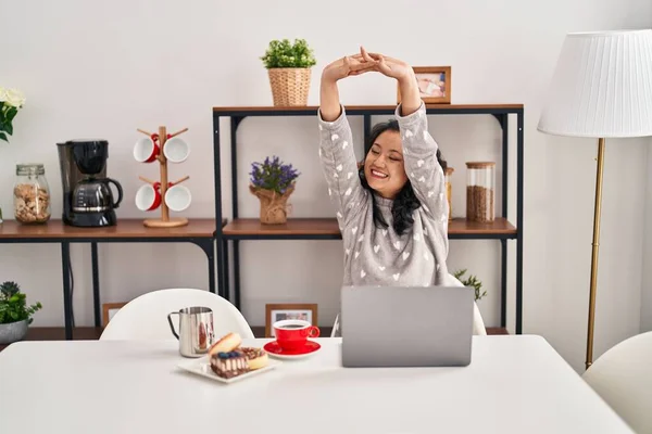 Young Chinese Woman Stretching Arms Working Home — Stock fotografie