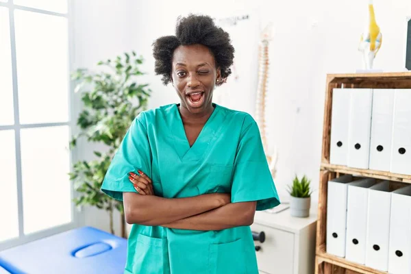 African Young Physiotherapist Woman Working Pain Recovery Clinic Winking Looking — Photo