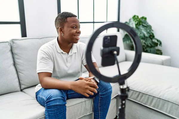 Young African Man Recording Vlog Tutorial Smartphone Home Looking Away — Foto Stock